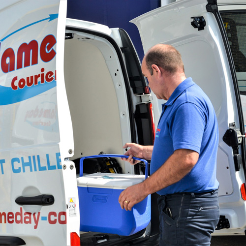 Courier Loading Refrigerated Vehicle with Medical Consignment Courier Loading Refrigerated Vehicle with Medical Consignment