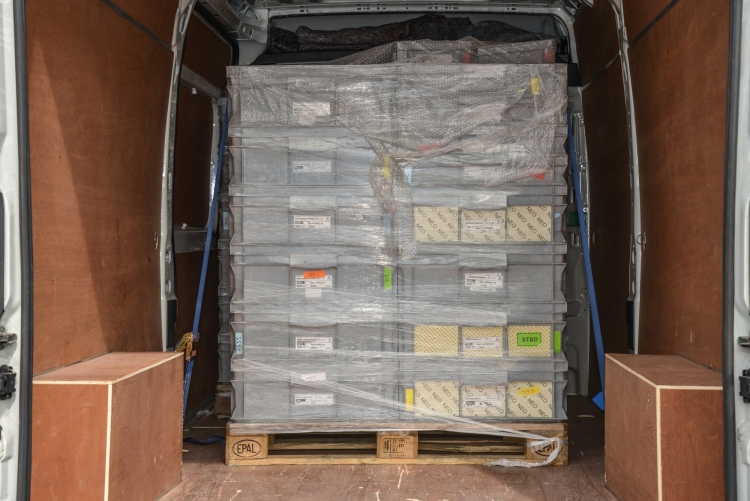 Nationwide Next Day Pallet Delivery Features Image of a pallet of goods in a courier vehicle