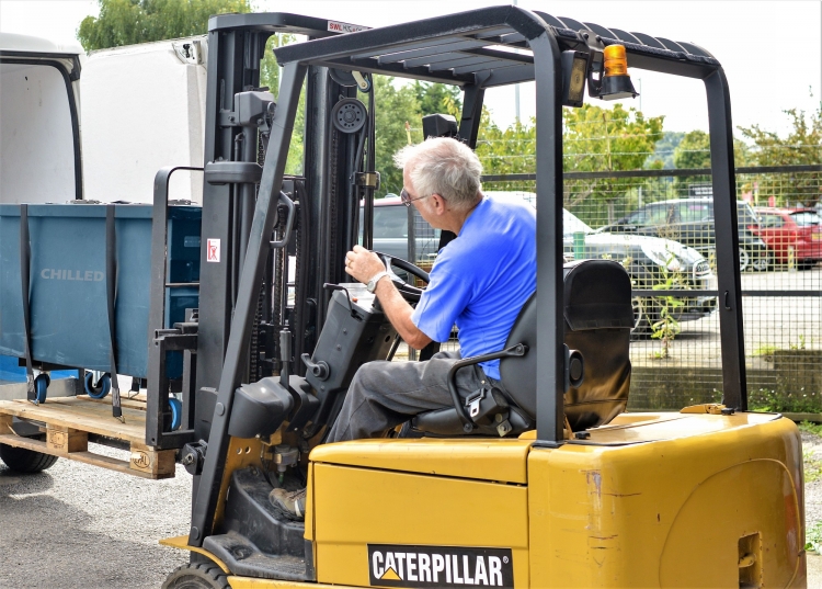 Bespoke Manufacturing Courier Image of a pallet being loaded into a same day courier vehicle