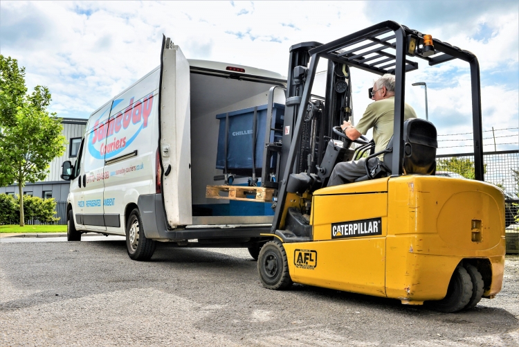 Image of a pallet being loaded into a courier vehicle